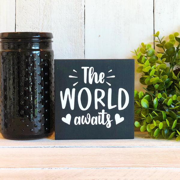 The World Awaits Freestanding Sign